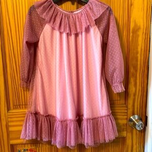 Girls pink/mauve with sheer sleeves with dot pattern.